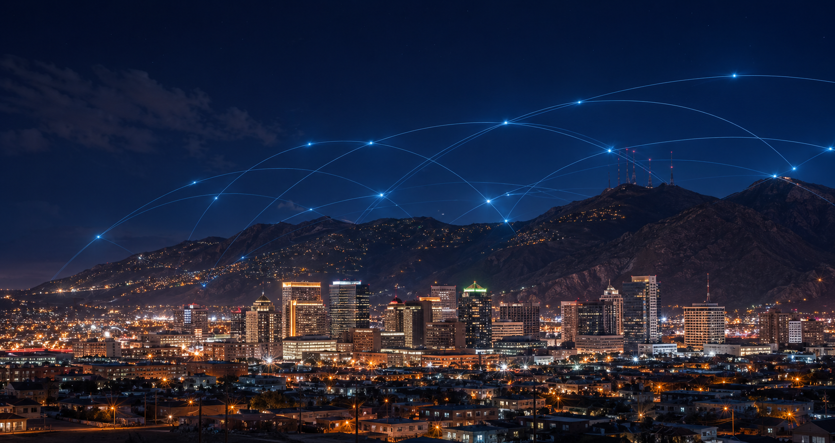 El Paso skyline at night with subtle network arcs overhead.